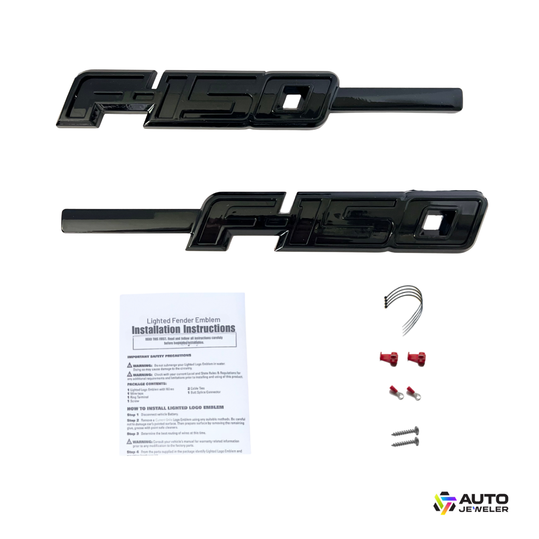 Gloss black F-150 LED fender emblem kit with two emblems, installation instructions, wiring, connectors, and screws on a white background.