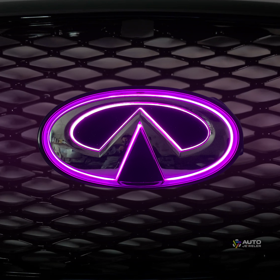 Close-up of Infiniti Q50 RGB emblem glowing purple on front grille