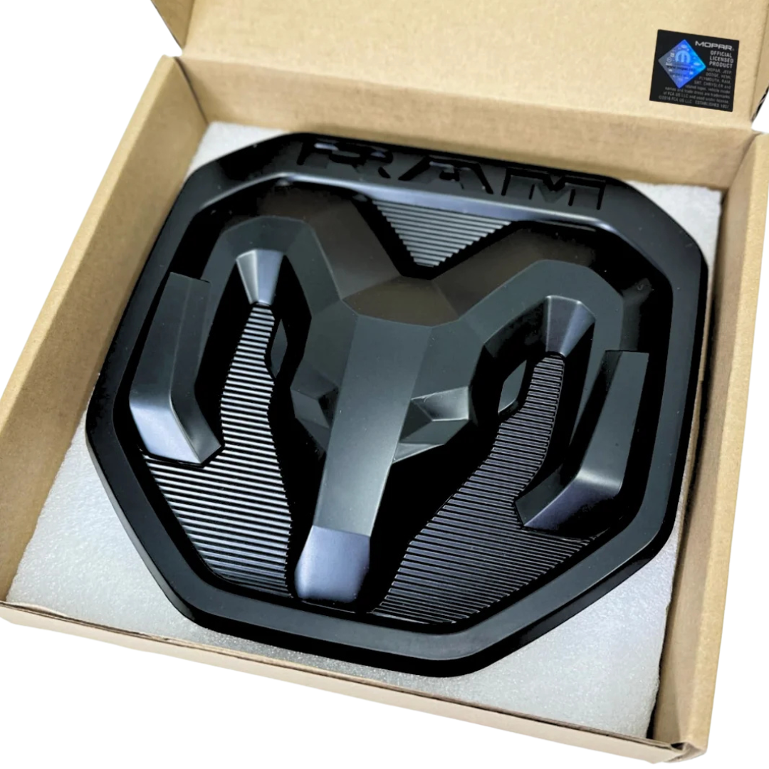 RAM Black Edition tailgate emblem in retail packaging box with protective foam insert