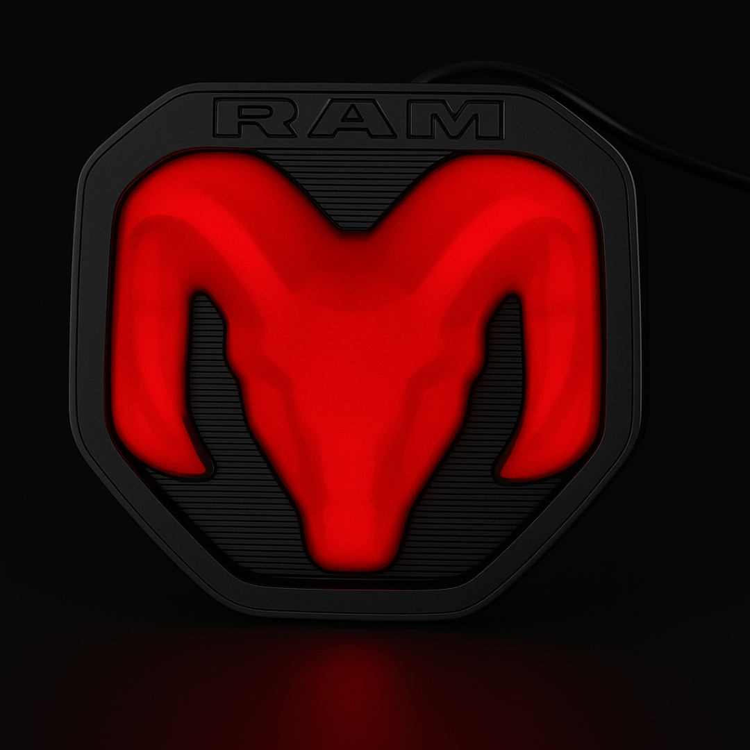 lose-up studio photo of RAM LED tailgate emblem powered on, red glow on black background