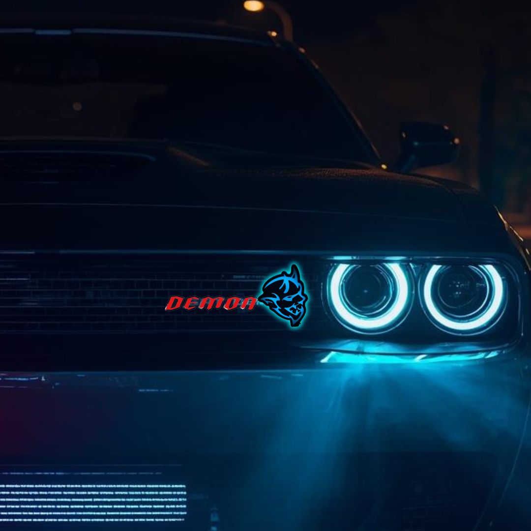 Flow Series LED Demon head grille emblem installed on dodge charger at night, logo illuminating in blue