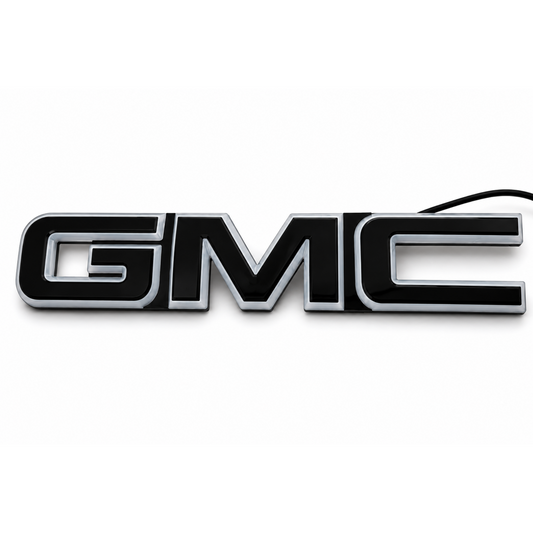 AutoJeweler 2019-2026 GMC LED illuminated Grille Emblem on a plain white background.