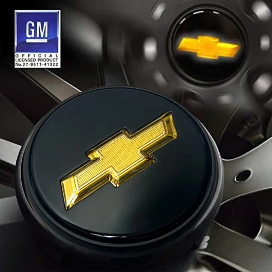 GM-licensed illuminated Chevy wheel center cap, 83 mm gold bowtie on black, installed on Silverado/Suburban/Tahoe wheel.