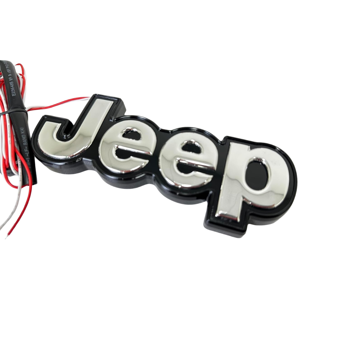 AutoJeweler Chrome Jeep lighted tailgate emblem with black housing and wiring – front angle view