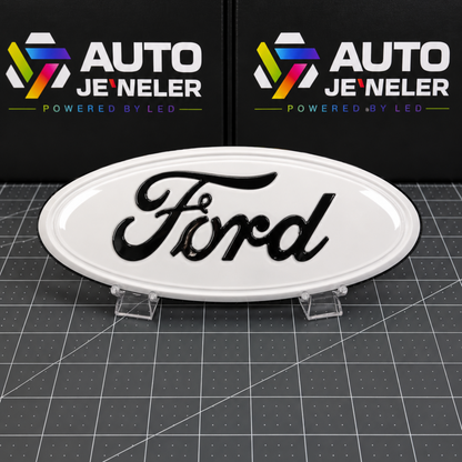 AutoJeweler Custom painted Oxford  White Ford 9-inch grille and tailgate emblem with gloss black Ford script shown with the LEDs off.