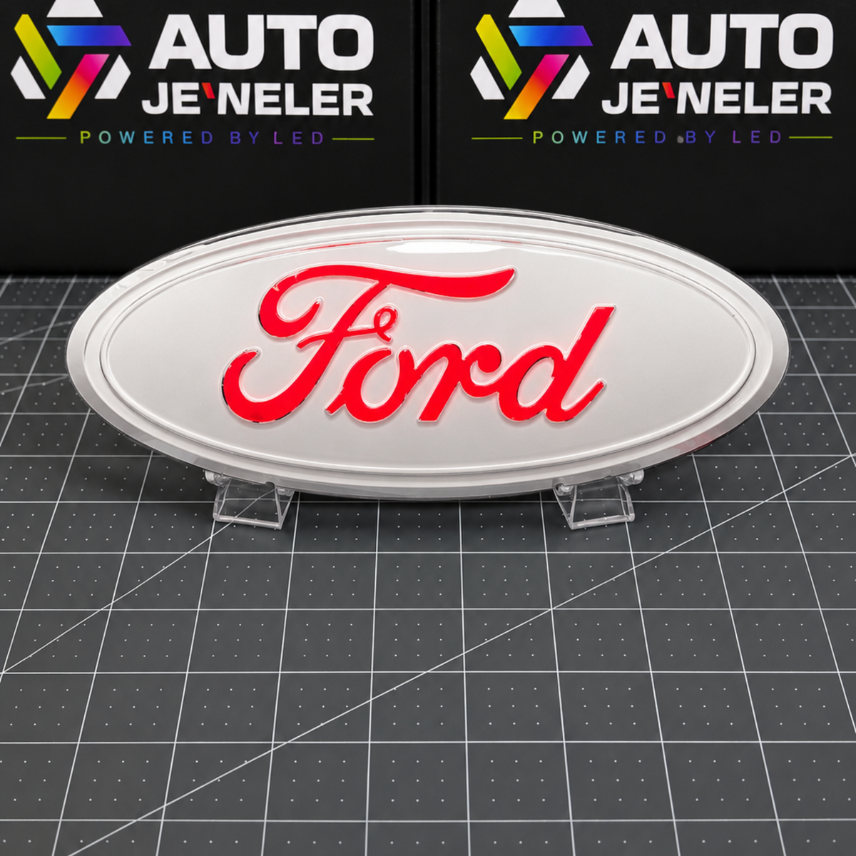 Custom painted white Ford 9-inch grille and tailgate emblem illuminated with bright red LED Ford script.