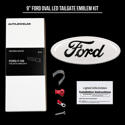 Oxford White Ford 9-inch dynamic LED tailgate badge kit with badge, wiring, connectors, mounting hardware, installation instructions, and AutoJeweler packaging.