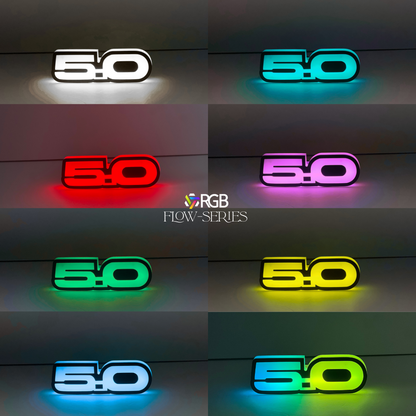 Ford Mustang 5.0 RGB Flow Series LED grille emblem glowing in white , red, green, blue, purple, yellow, and blue yellow.