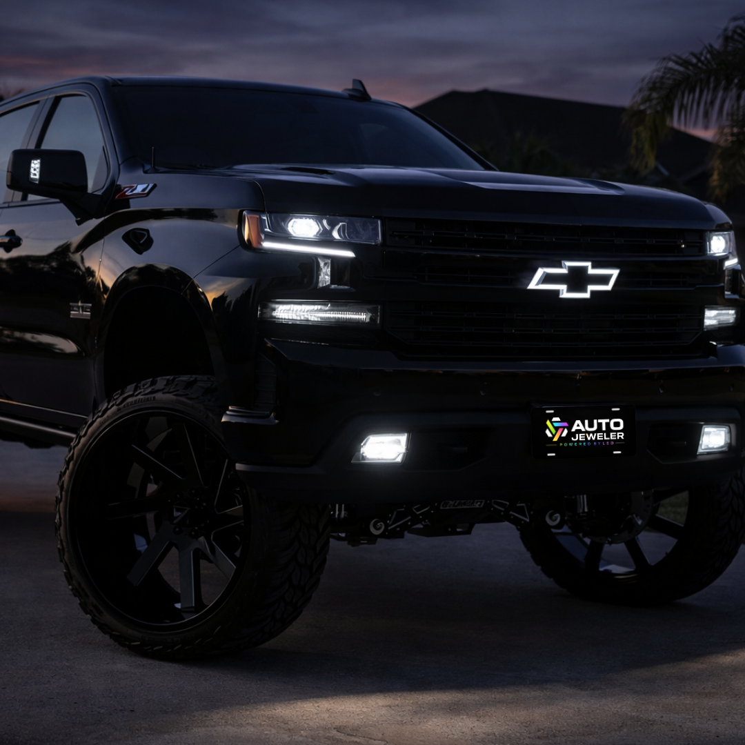2016–2018 Chevy Silverado 1500 with all-black LED bowtie grille emblem installed, white LED illuminated at sunrise, front 3/4 lifestyle view