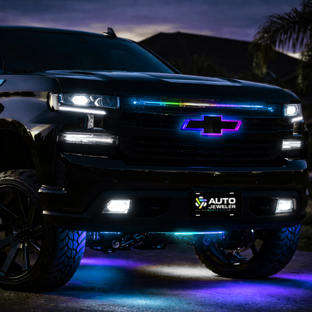 Chevy Silverado with RGB grille emblem glowing at dusk