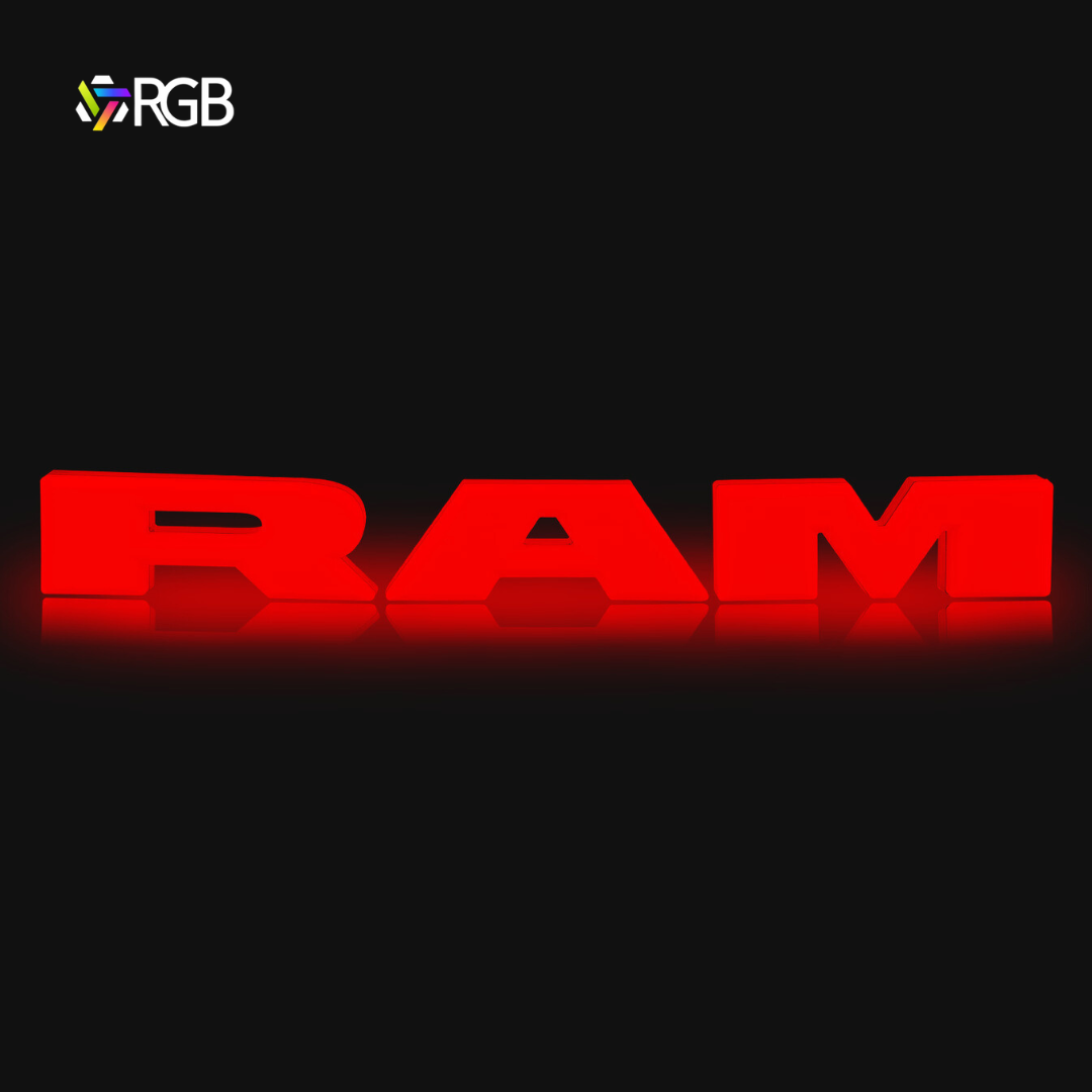 RAM 1500 black RGB LED grille emblem illuminated in red, glowing effect on black background, AutoJeweler RGB branding