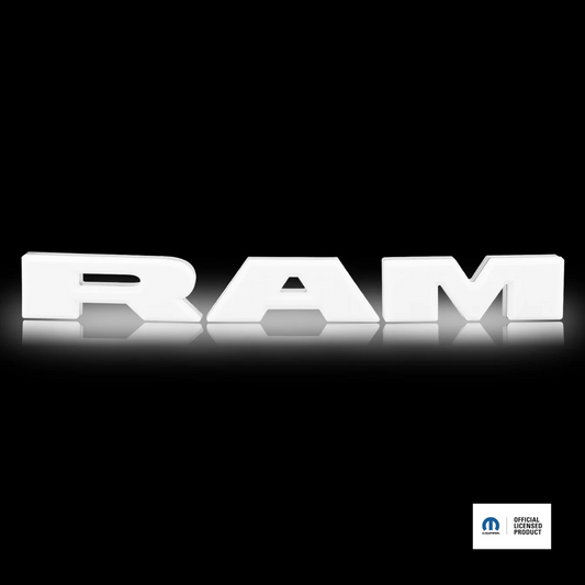 White 'RAM' logo on a black background with a visible license plate icon.