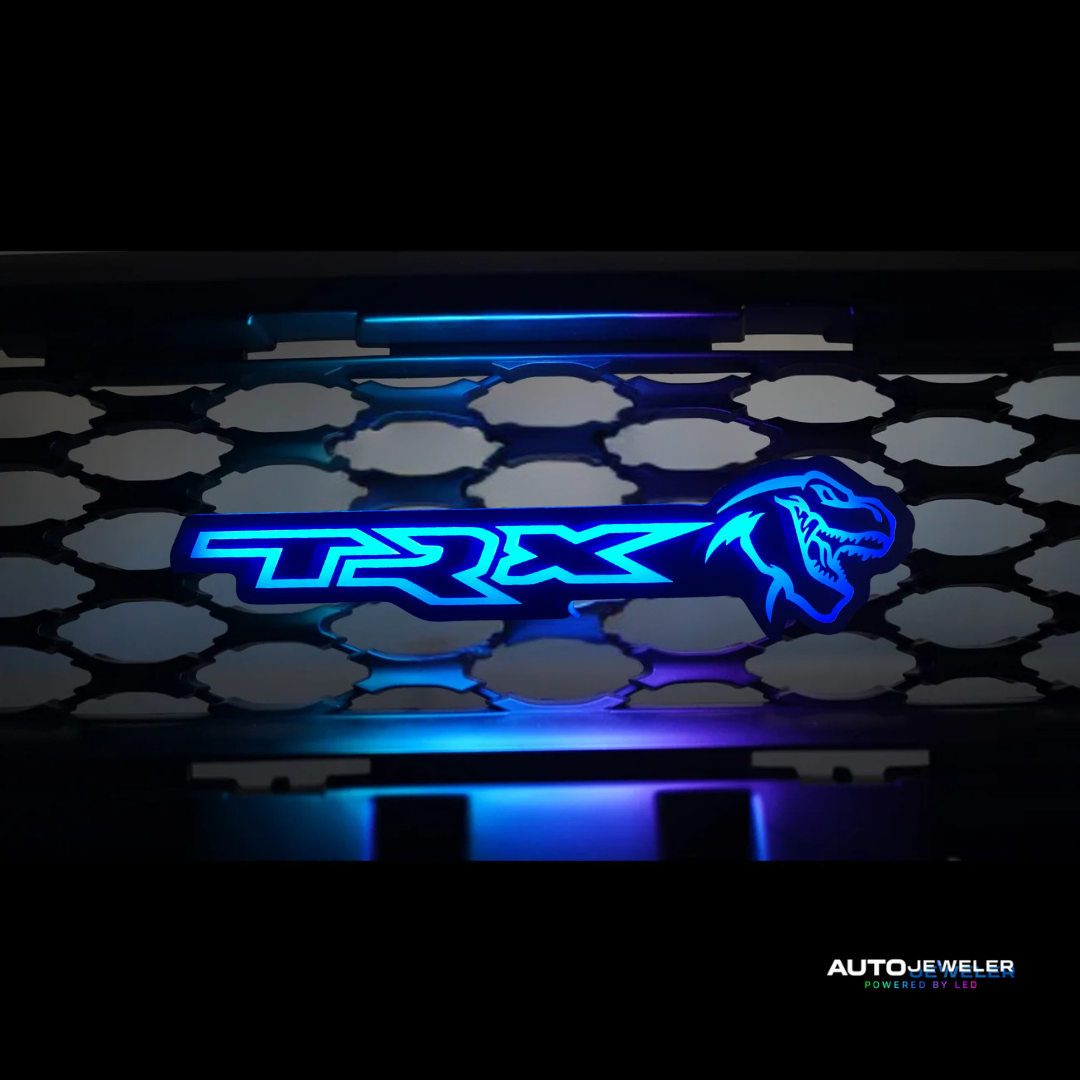 TRX logo on a car grille with blue lighting effect