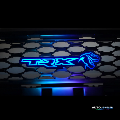 TRX logo on a car grille with blue lighting effect