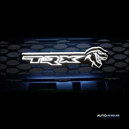 TRX logo on a car grille with a honeycomb pattern