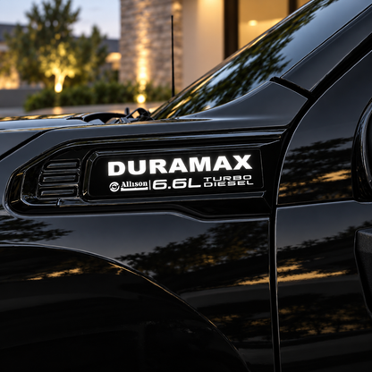 2020–2027 GMC Sierra HD Duramax LED fender badge illuminated white on black truck