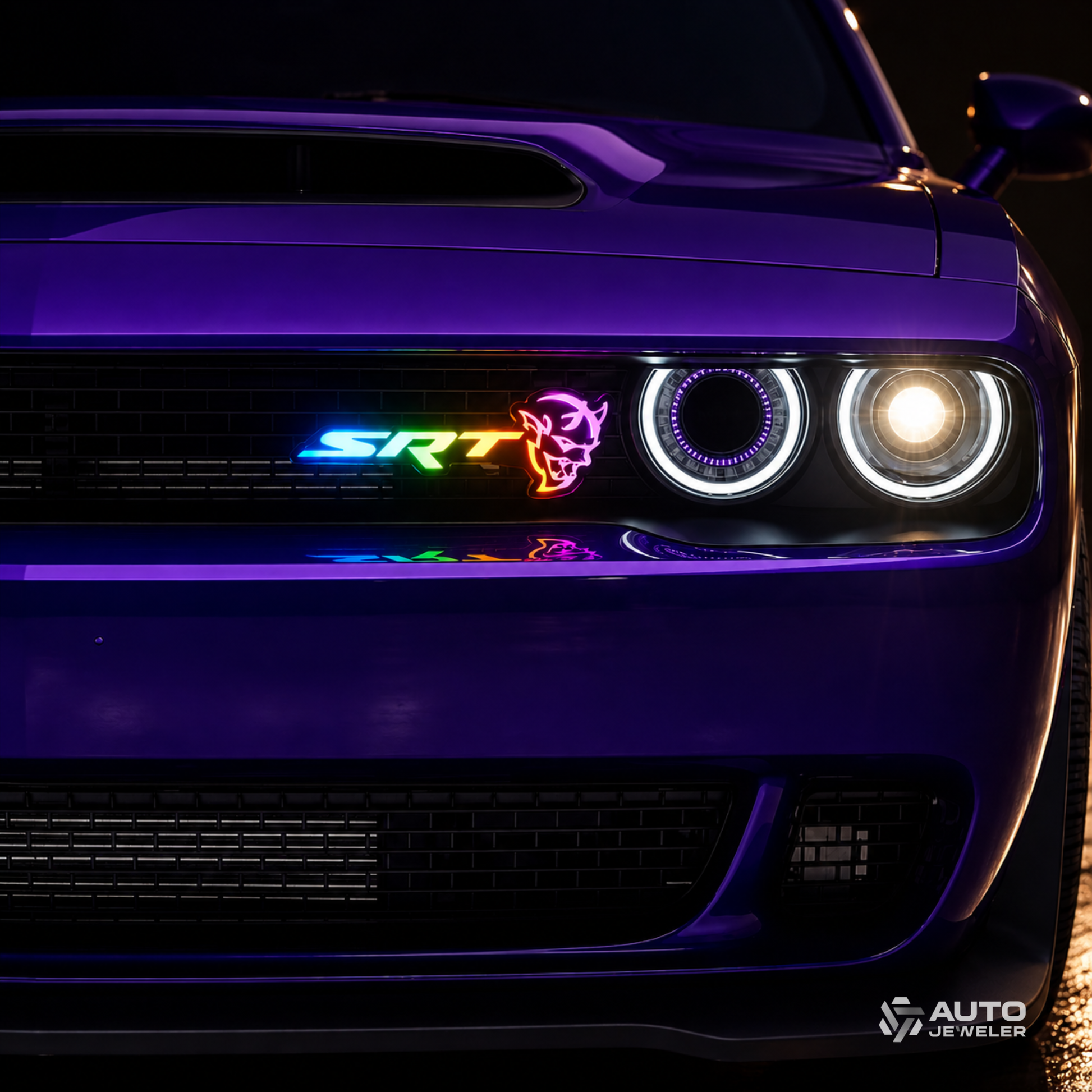 SRT Demon RGB Flow Series LED grille emblem installed on a Dodge Challenger, displaying multicolor flow lighting effects on a purple muscle car at night.
