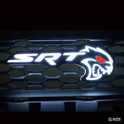 Flow Series RGB LED Hellcat Redeye-style grille emblem showing cool white lighting mode on mesh grille
