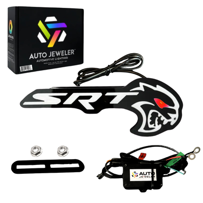 AutoJeweler Flow Series Hellcat Redeye-style LED grille emblem kit contents showing emblem, branded box, controller module, and wiring harness