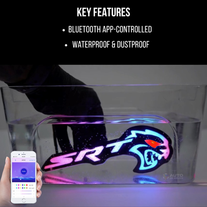 Flow Series Hellcat Redeye-style LED grille emblem waterproof test shown in water with Bluetooth app control