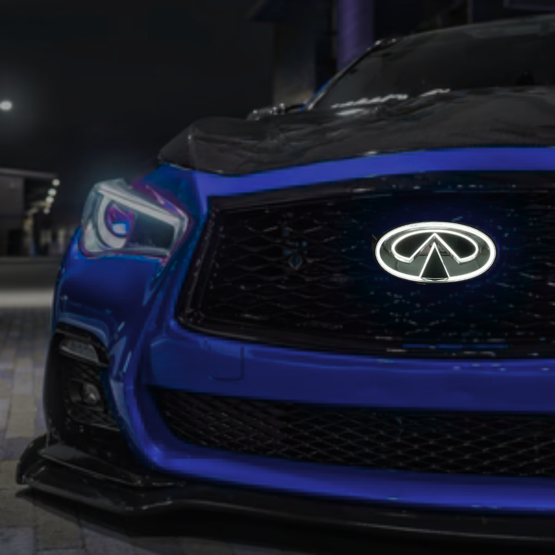 Close-up of a blue Infiniti car's front grille with logo.