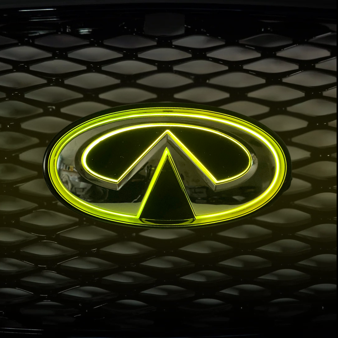 Infiniti Q50 RGB LED grille emblem glowing yellow on mesh grille