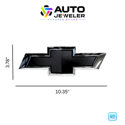 Chrome and black Chevy bowtie RGB grille emblem with dimensions labeled 10.35 inches wide by 3.78 inches tall, AutoJeweler branding above and GM mark below.