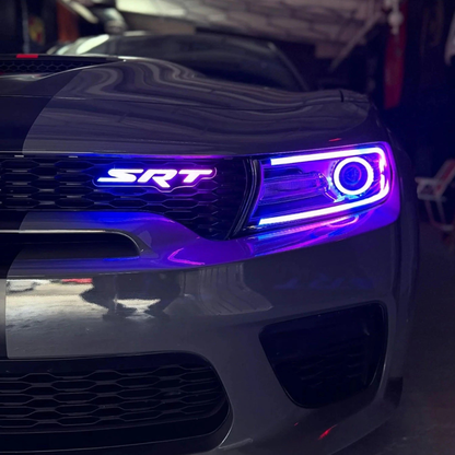 Car grille with SRT logo and illuminated LED lights in a garage setting