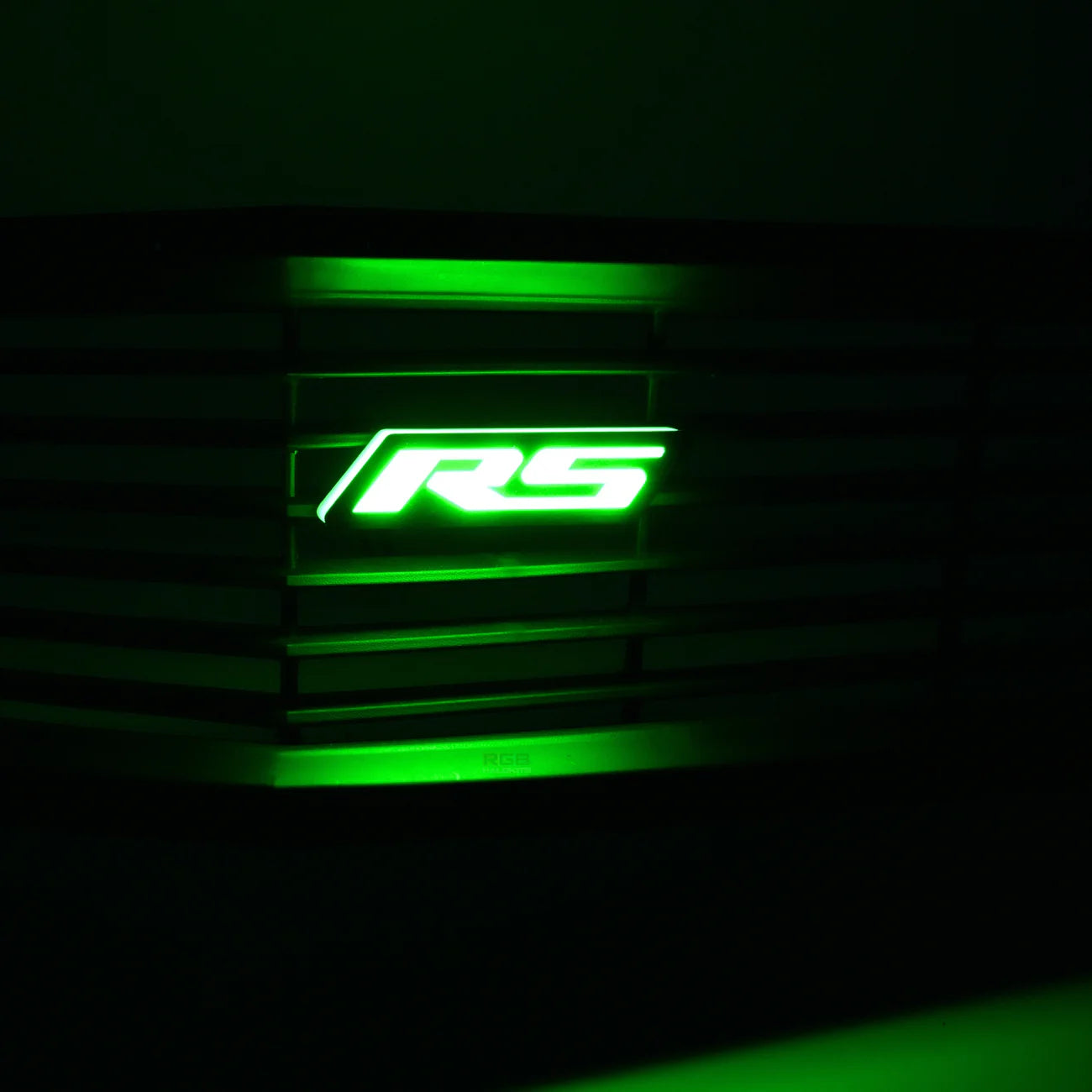 RS Flow Series LED emblem glowing green installed in front grille