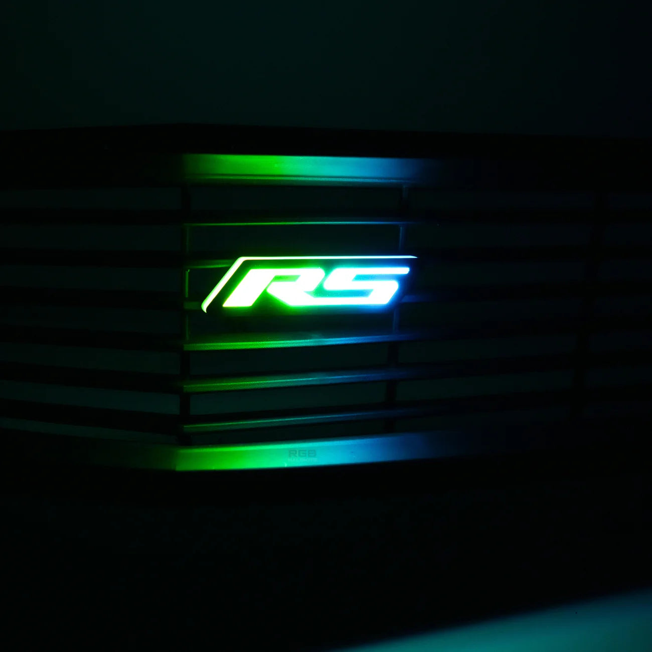 AutoJeweler RS Flow Series LED emblem illuminated blue and green on vehicle grille