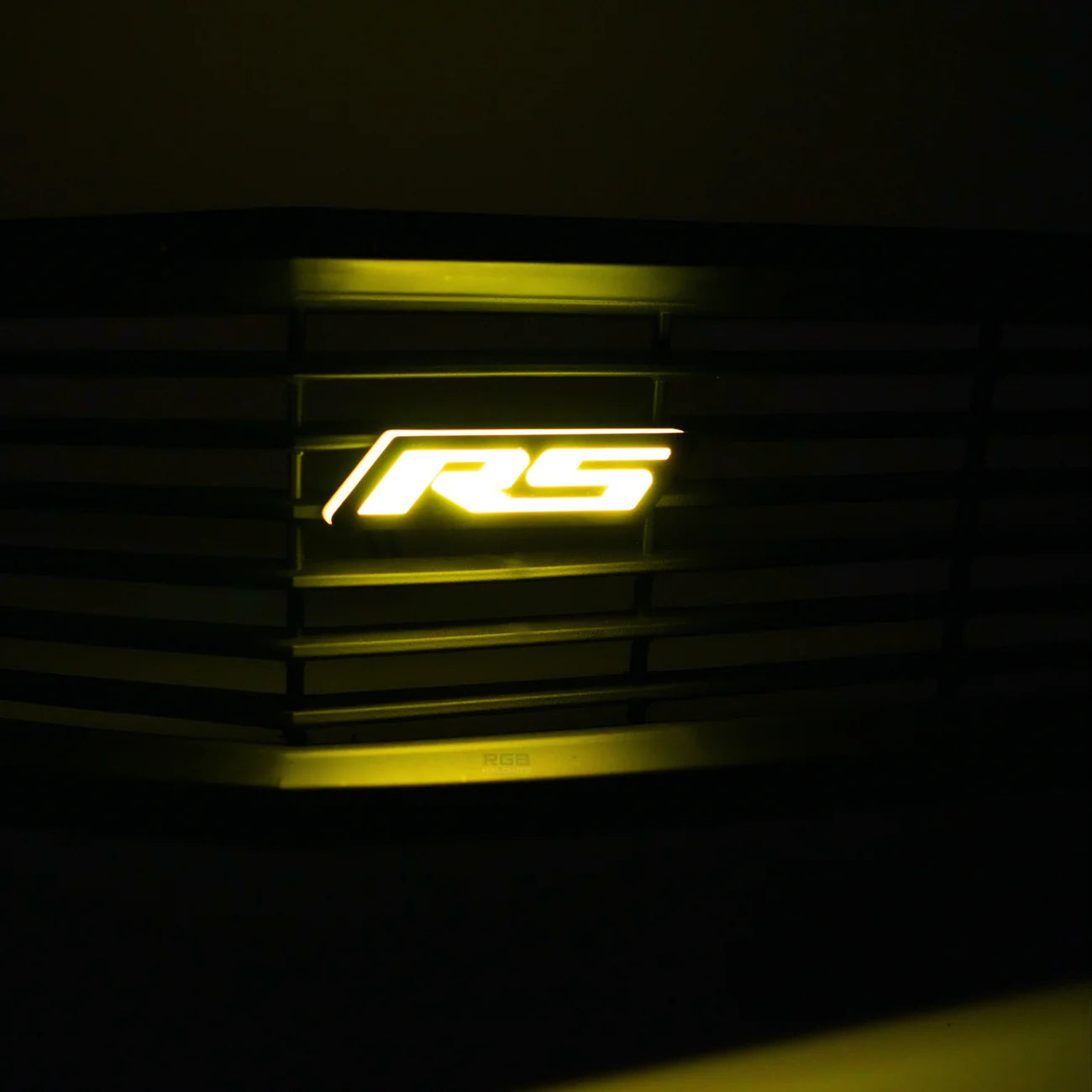 AutoJeweler RS Flow Series LED emblem illuminated yellow on vehicle grille