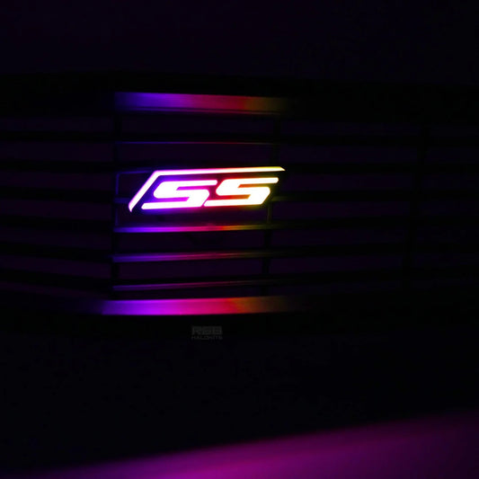 Chevy Camaro SS RGB Flow Series LED grille emblem showing multicolor flowing animation close-up at night