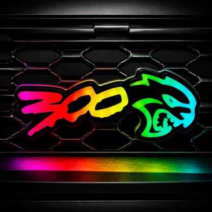 Chrysler 300 Hellcat V2 Style RGB Flow Series LED grille emblem glowing in rainbow flow mode on a black mesh grille.
