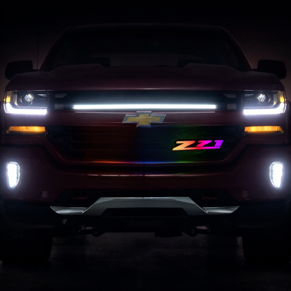 Chevy Z71 RGB Flow Series LED grille badge installed on Silverado with flowing color animation
