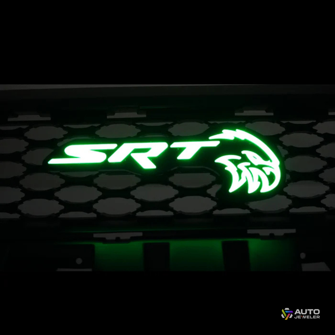 AutoJeweler SRT Trackhawk Hellhawk RGB Flow Series LED grille emblem illuminated in solid green on honeycomb grille