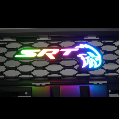 AutoJeweler SRT Hellcat RGB Flow Series LED grille emblem installed on honeycomb grille showing multicolor rainbow lighting effect