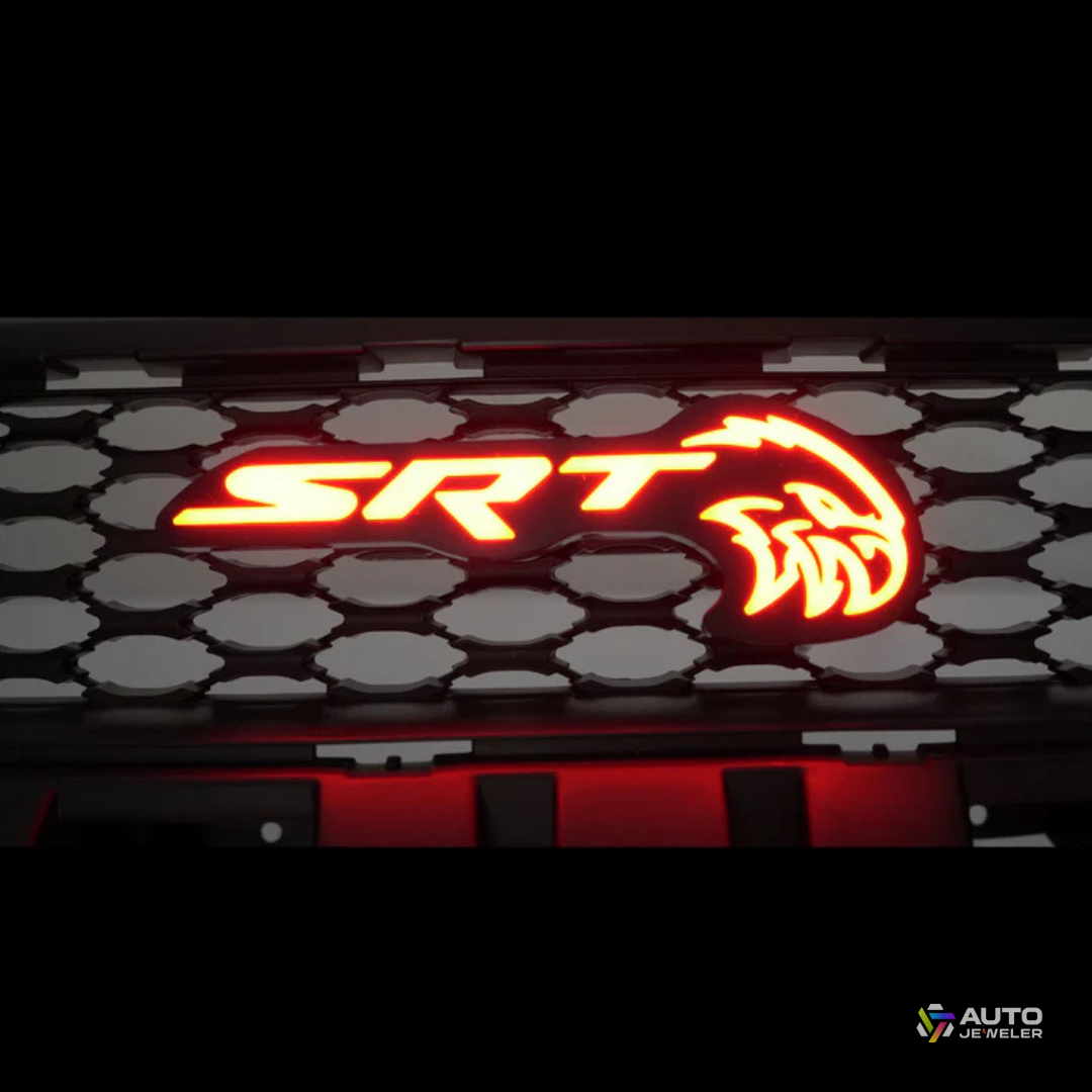 AutoJeweler SRT Trackhawk Hellhawk RGB Flow Series LED grille emblem illuminated in solid red on honeycomb grille