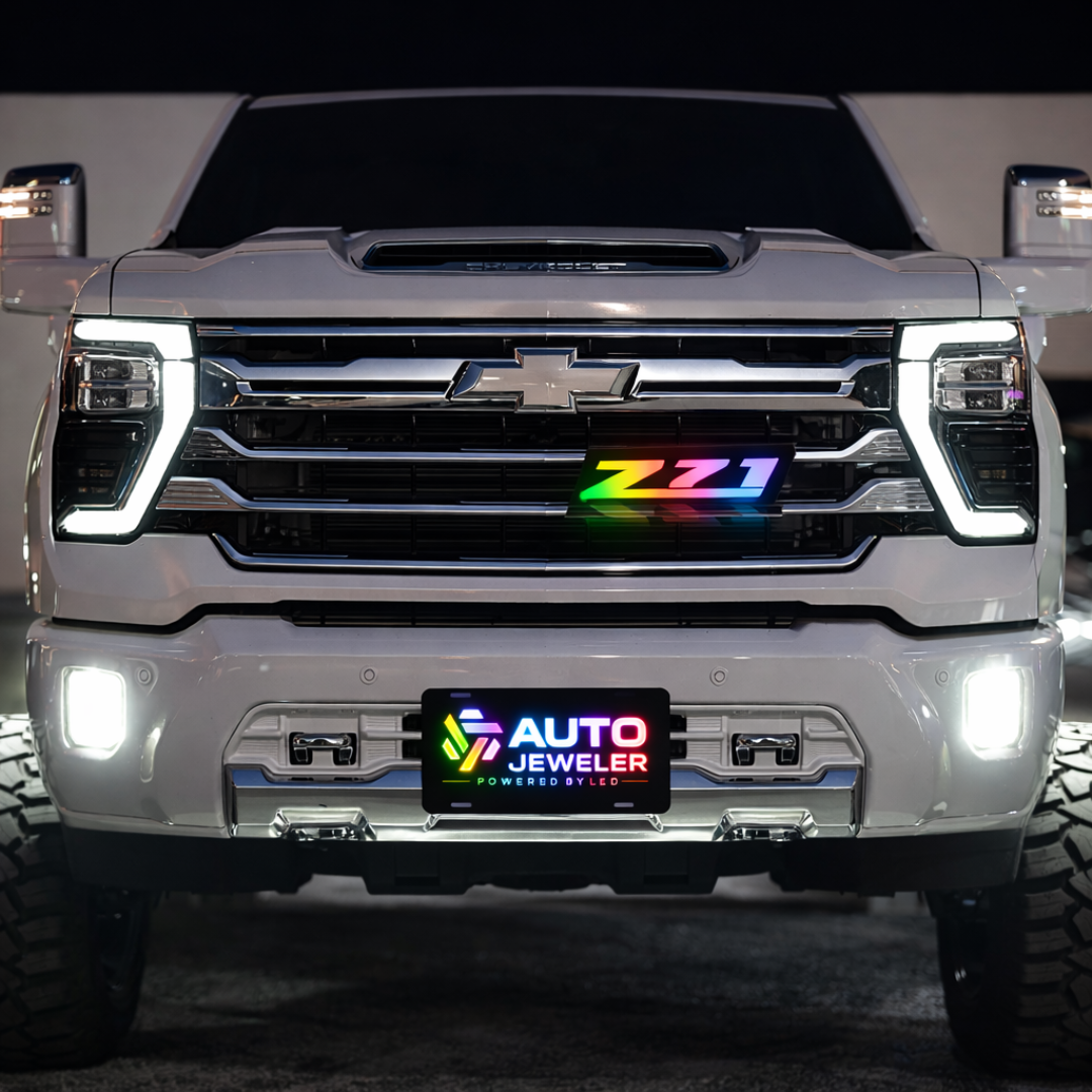 AutoJeweler Z71 RGB Flow Series LED grille emblem installed on Chevy Silverado front grille with multicolor lighting and OEM-style fitment