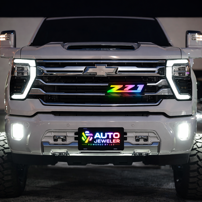 AutoJeweler Z71 RGB Flow Series LED grille emblem installed on Chevy Silverado front grille with multicolor lighting and OEM-style fitment
