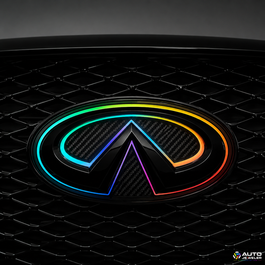 Close-up of the AutoJeweler 2018–2024 Infiniti Q50 V2 Multicolor Flow Series LED grille emblem featuring a gloss black housing, carbon fiber face, and animated RGB Flow lighting installed in the factory grille.