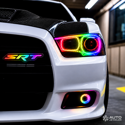 Multicolor carbon fiber SRT RGB grille emblem installed on a white Dodge vehicle with matching RGB headlights and fog light.