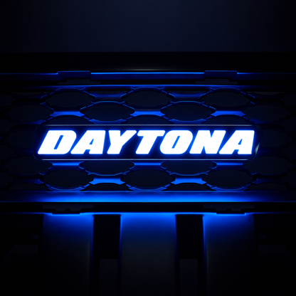 Daytona LED grille emblem illuminated in bright blue lighting mode with gloss black housing and grille background