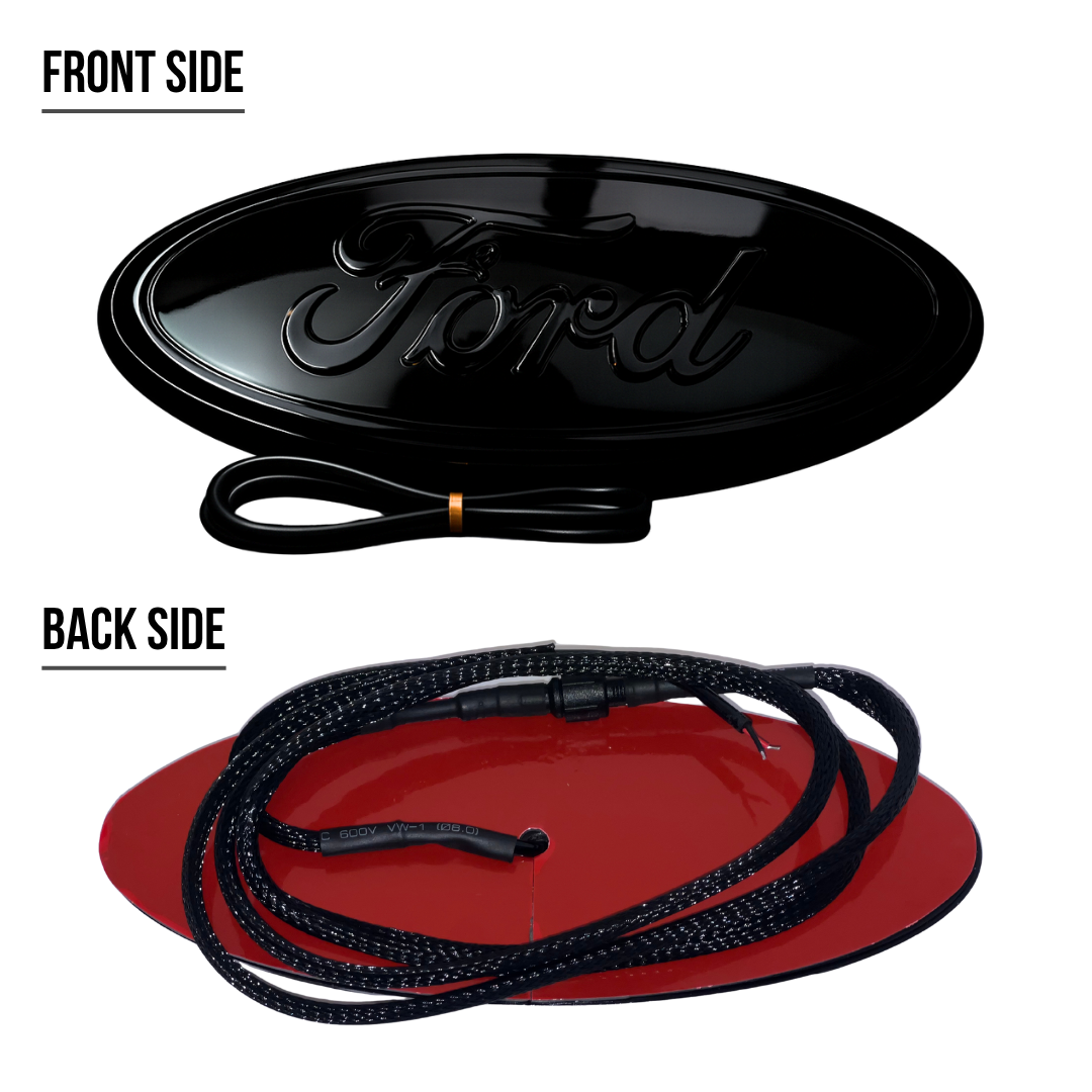 Front and back of AutoJeweler 9-inch Ford LED emblem showing gloss face, red adhesive backing, and braided wire lead.
