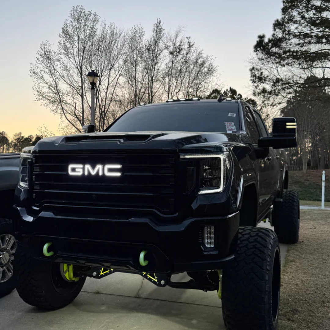 GMC truck with pure white RGBW illuminated grille emblem installed