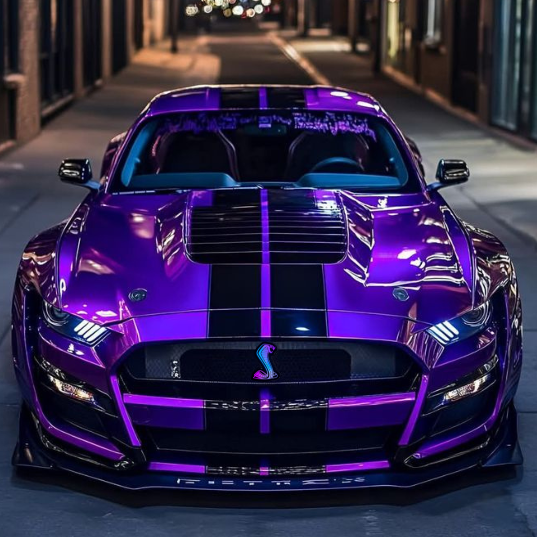 RGBW Mustang Cobra Grille Emblem installed on custom purple Shelby Mustang with black racing stripes at night