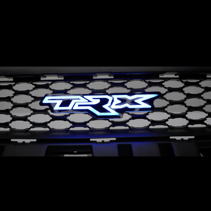 TRX LED grille badge illuminated in blue mounted in the front grille