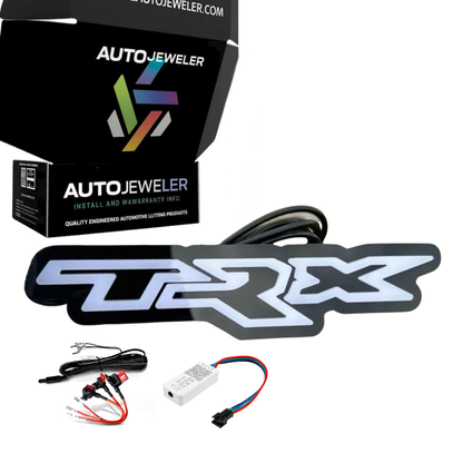 TRX LED grille badge kit including emblem, wiring harness, Bluetooth controller, and AutoJeweler packaging