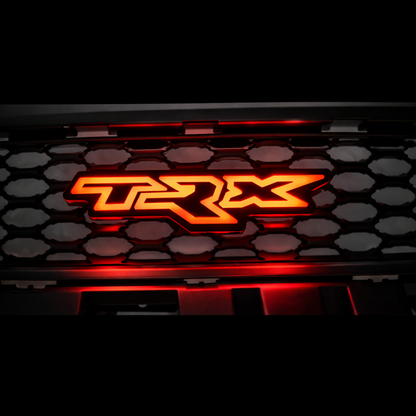 TRX LED grille badge illuminated in red showing solid color LED mode