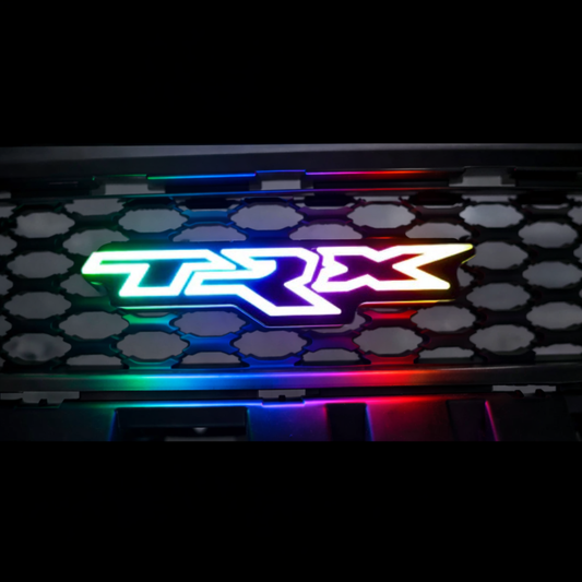 RAM TRX LED grille badge with RGB Flow Series lighting showing multiple color modes