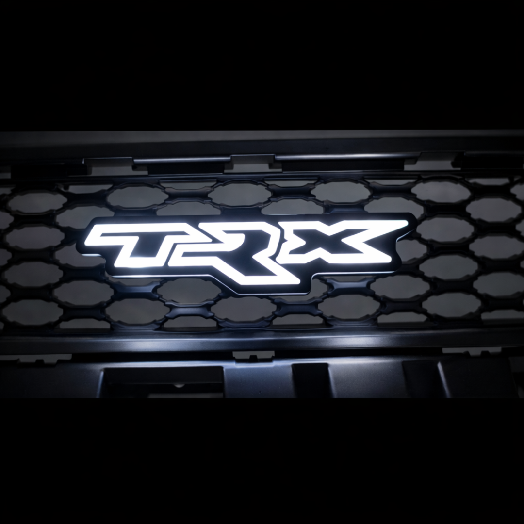 TRX LED grille badge illuminated in solid white mounted on RAM TRX grille